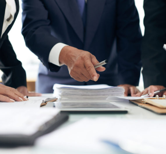 I found evidence here Cropped image of lawyer showing evidence he found in papers to coworker